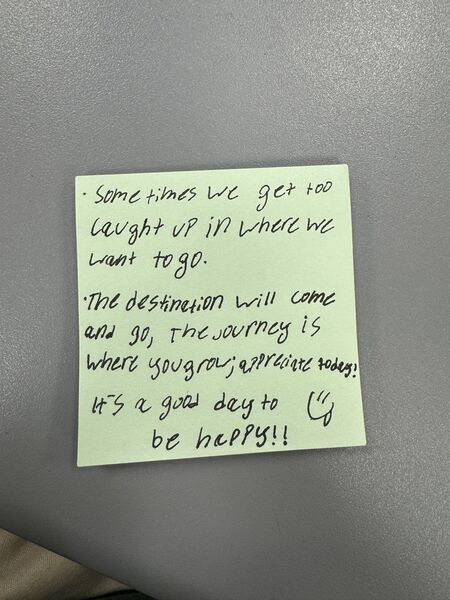 Handwritten sticky note with words of encouragement